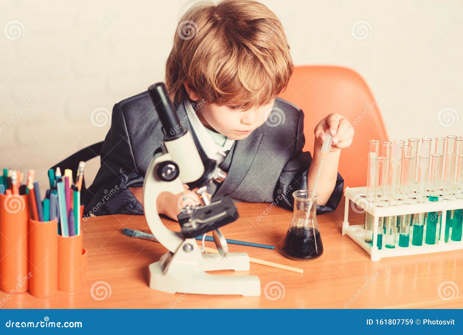 Life Under Microscope. Science Experiments with Microscope in Lab. School Kid Scientist Studying