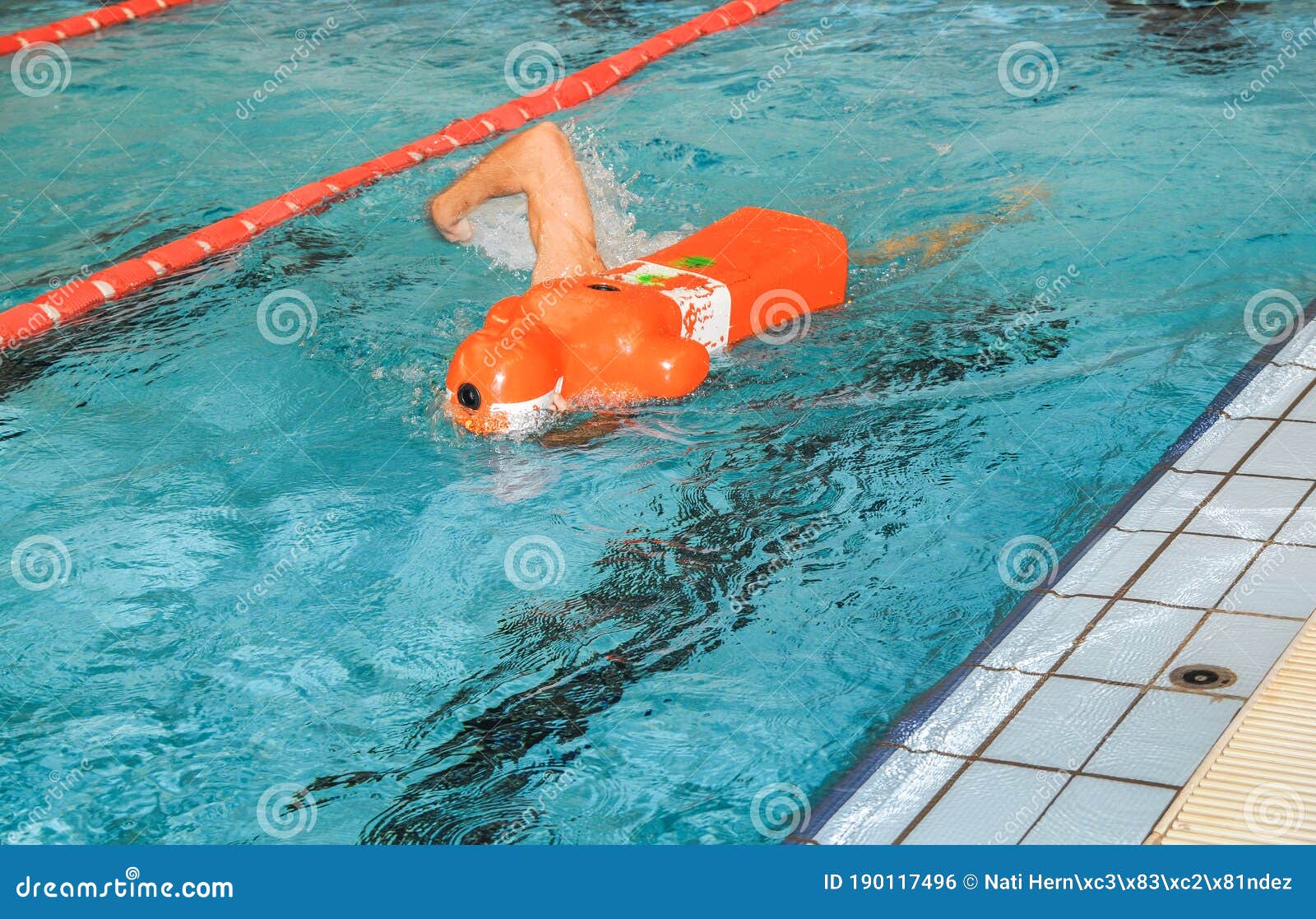 lifeguard training with rescue dummy in a pool