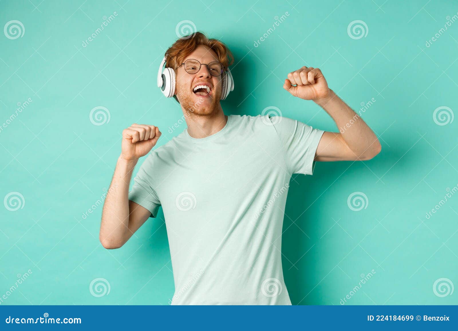 Lifestyle Concept. Carefree Guy with Red Hair, Dancing and Having Fun,  Listening Music in Headphones, Standing Over Stock Image - Image of  shopping, lifestyle: 224184699