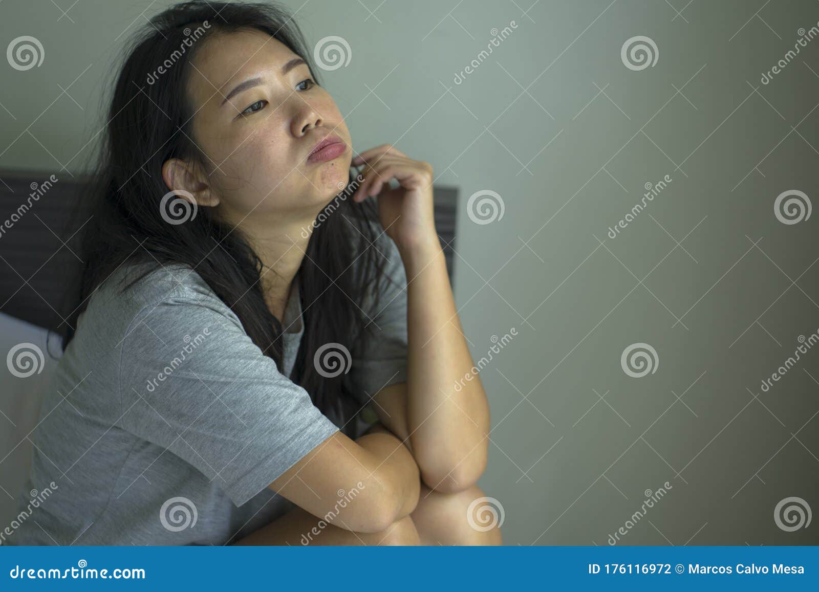 Lifestyle Indoors Portrait Of Young Attractive Sad And Depressed Asia