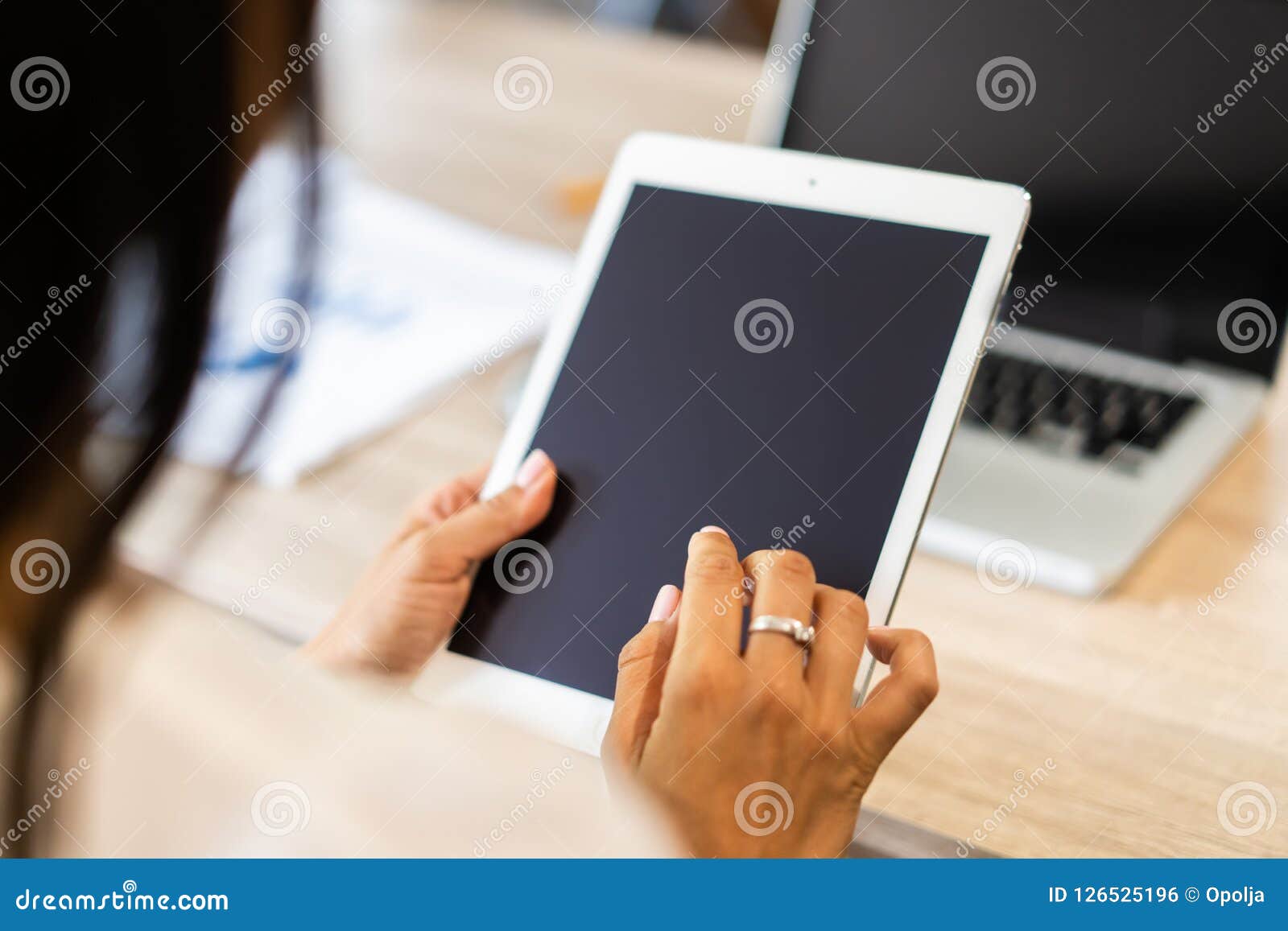 lifestyle with modern woman using tablet or ipad with hand holding touchscreen. hands of working woman with smart tablet