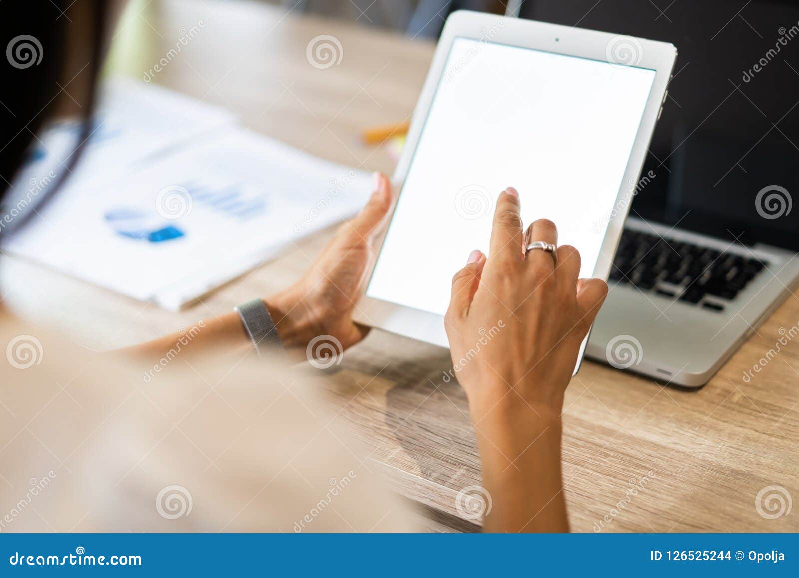 lifestyle with modern woman using tablet or ipad with hand holding touchscreen. hands of working woman with smart tablet
