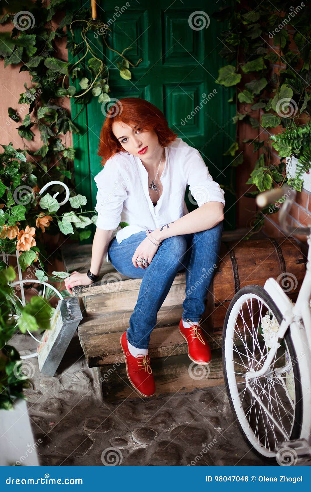 Lifestyle Portrait of Red Head Girl Wearing Blue Jeans, White Shirt and Red Shoes Stock Photo - of indoor, lifestyle: 98047048