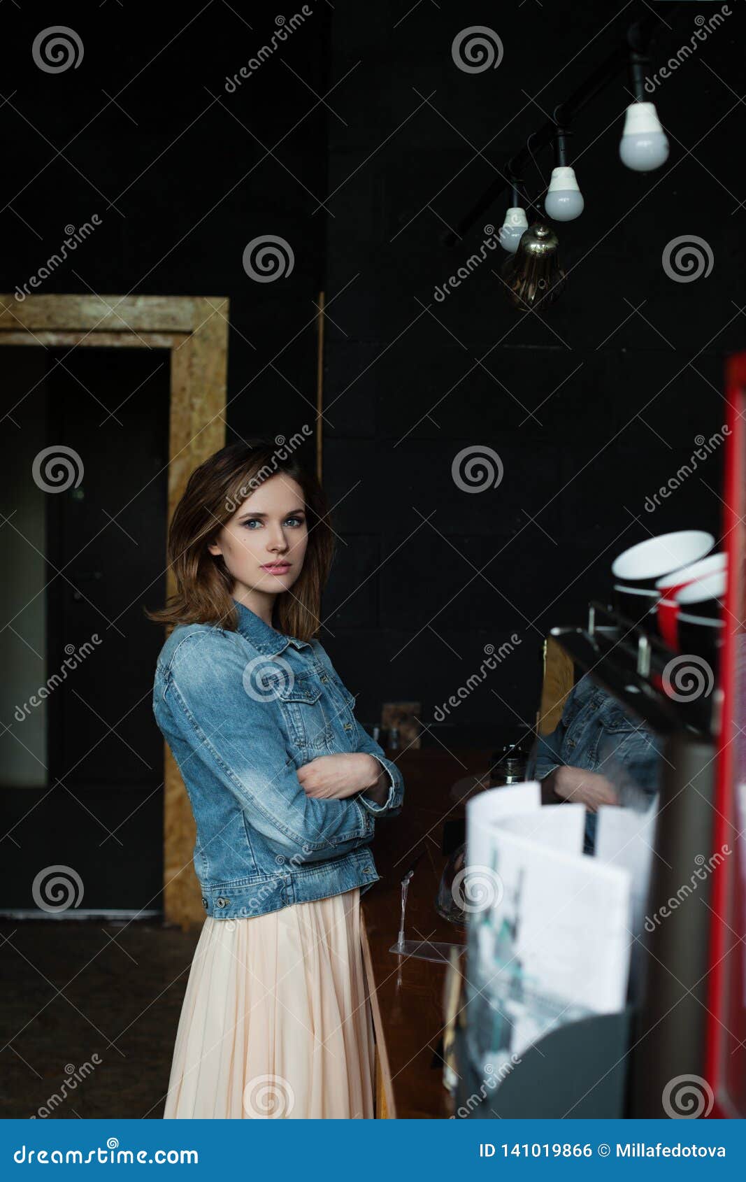 lifestyle portrait of young woman in cafee house