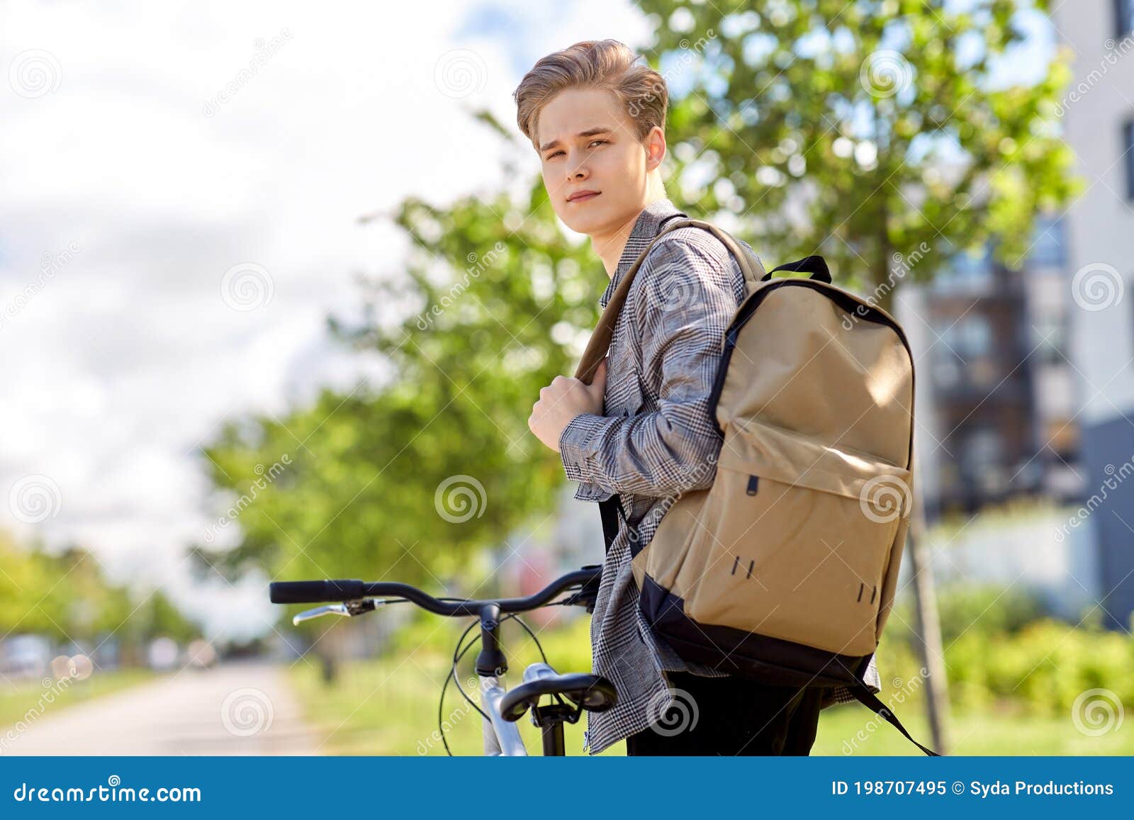 Young Man with Bicycle and Backpack on City Street Stock Image - Image ...