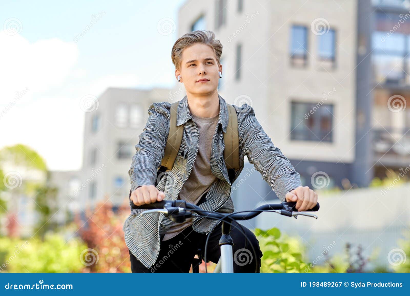 Student Boy with Bag and Earphones Riding Bicycle Stock Image - Image ...