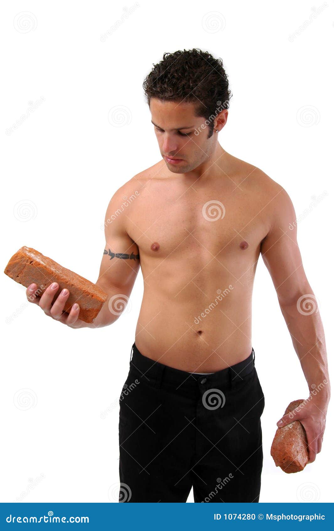 Lifting Bricks stock photo. Image of torso, naked, muscular 1074280