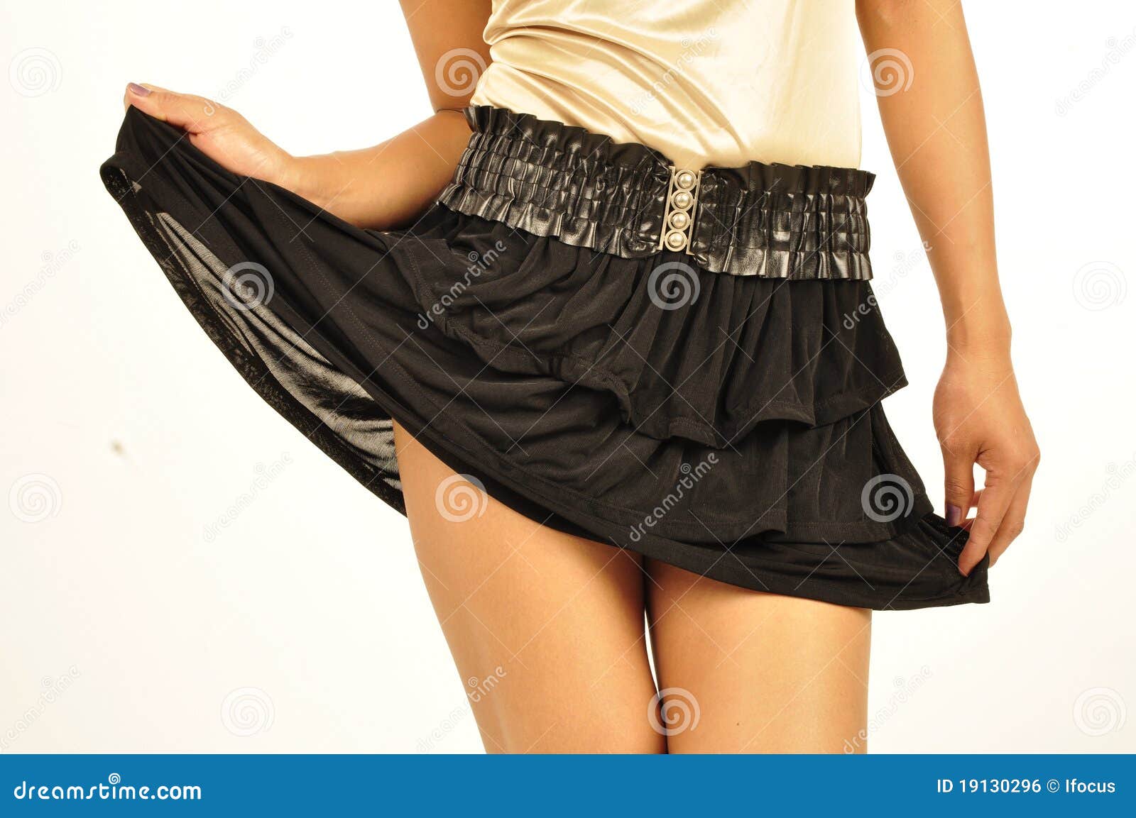 Lifting up her black skirt stock photo. Image of body 19130296