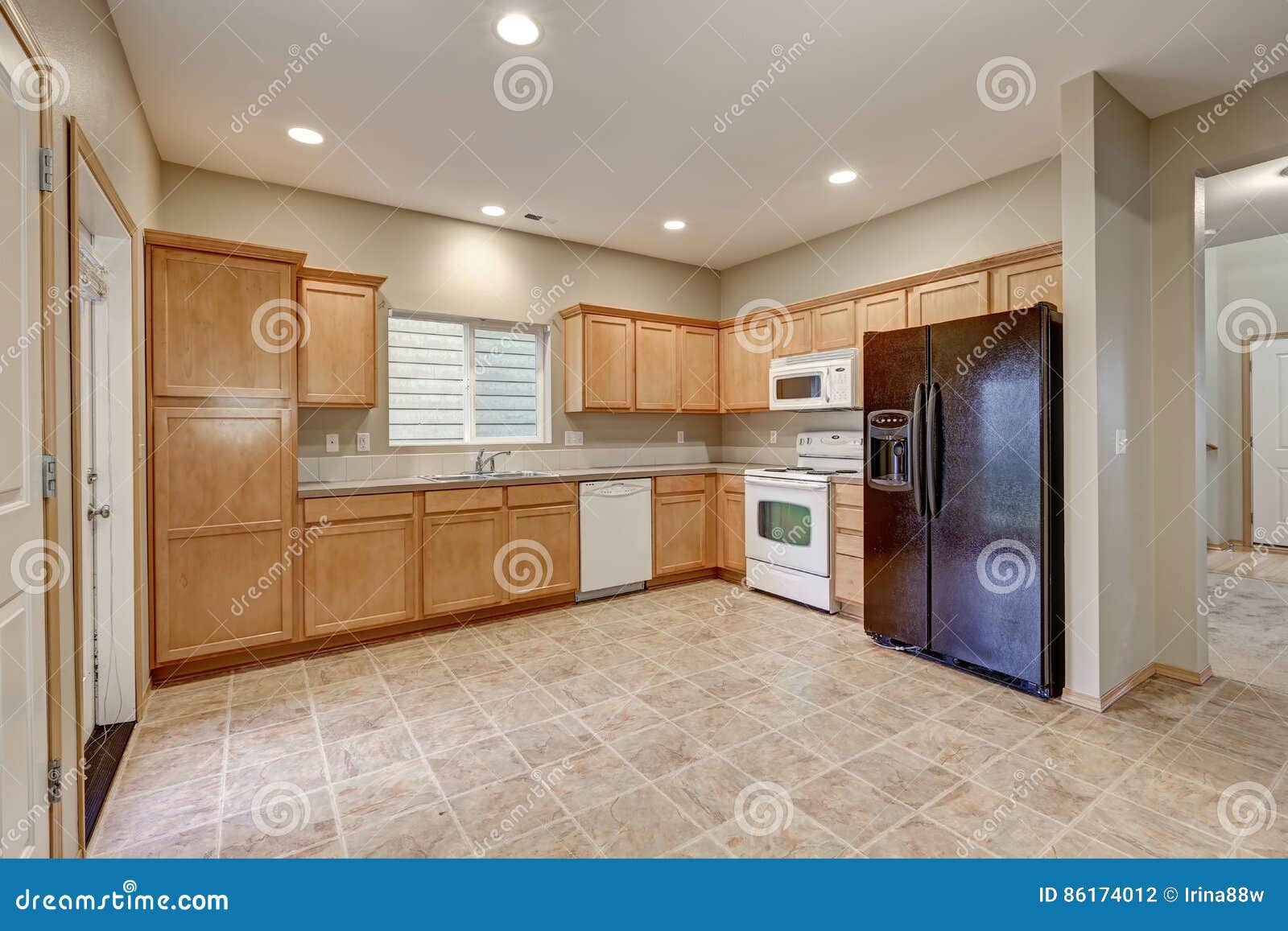 Light And Airy Kitchen Room With Beige Walls Stock Photo Image