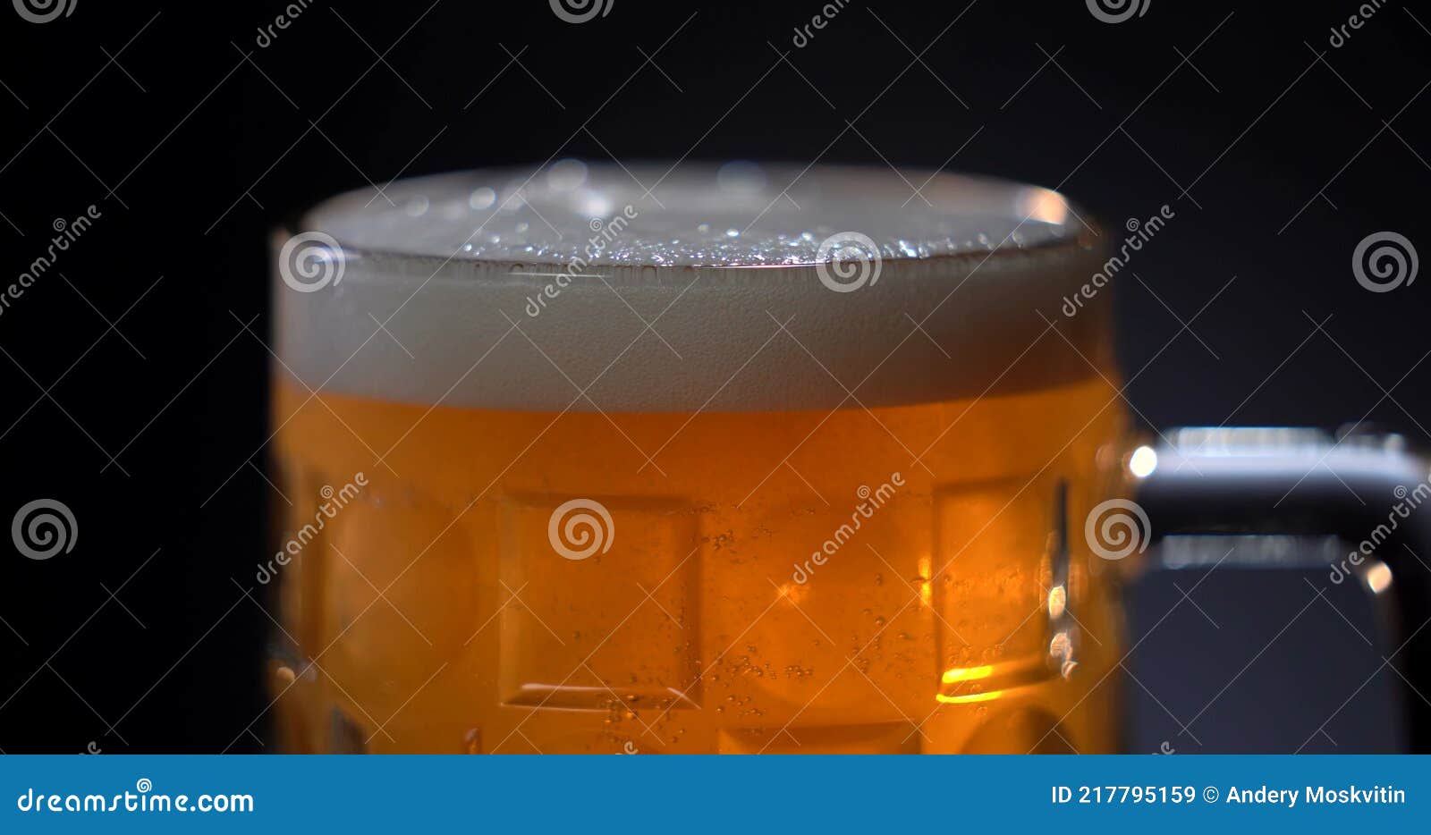 Light Beer Pouring in Glass. with Bubbles and Foam. Alcohol. Stock
