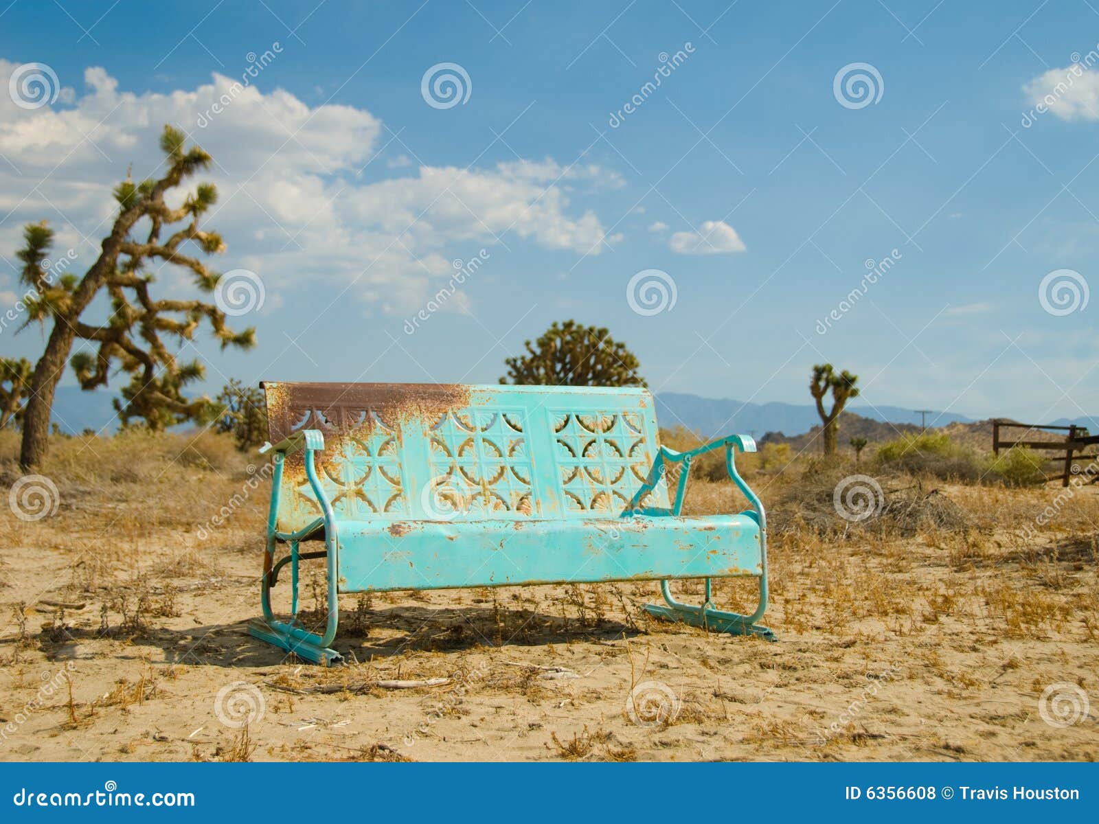 light blue bench forgotten in the california deser