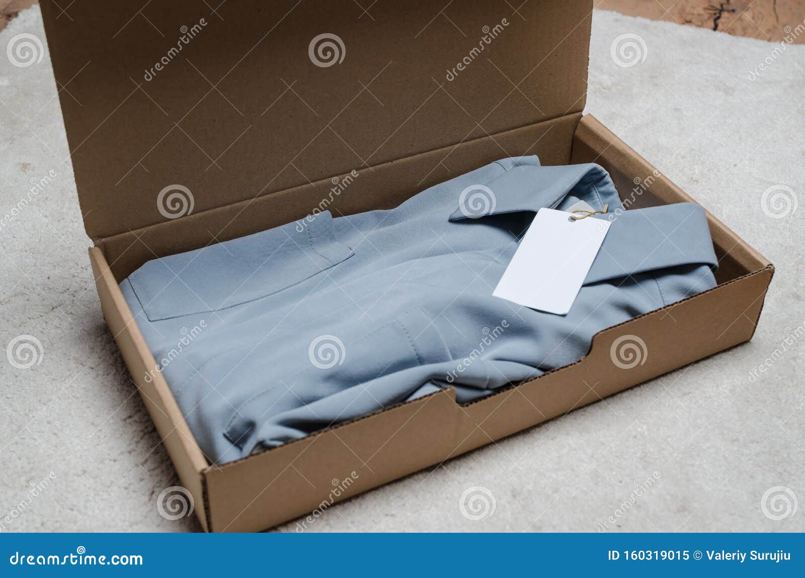 Light blue dress in a box stock image. Image of charity - 25