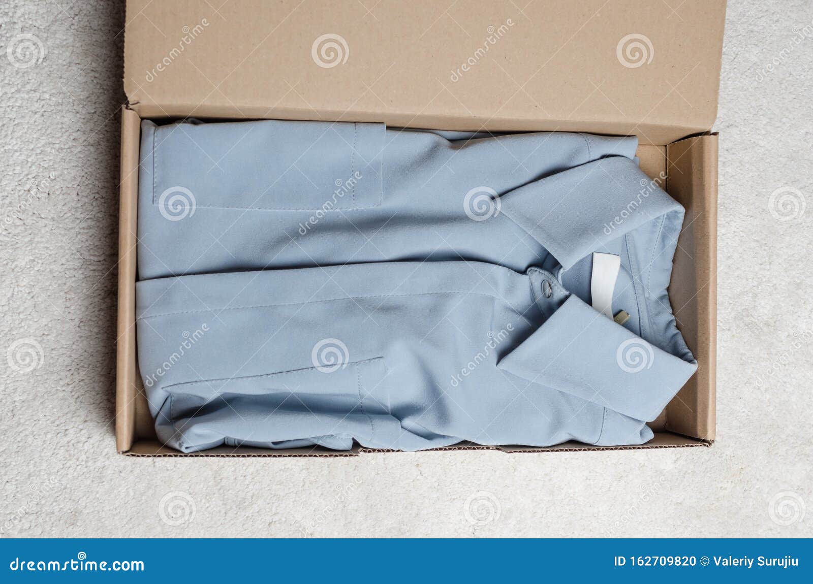 Light blue dress in a box stock photo. Image of anonymous - 26