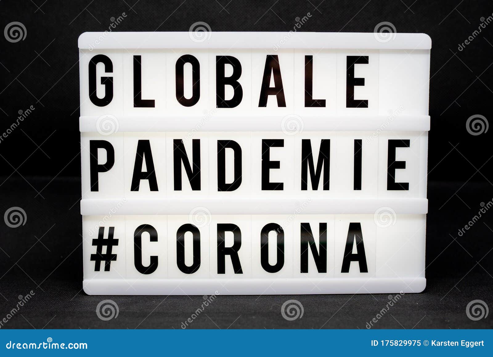 a light box with the inscription: globale pandemie #corona with white background