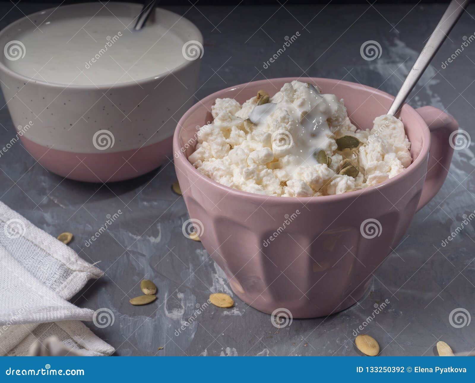 Light Breakfast Of Cottage Cheese And Sour Cream In Pink Dishes