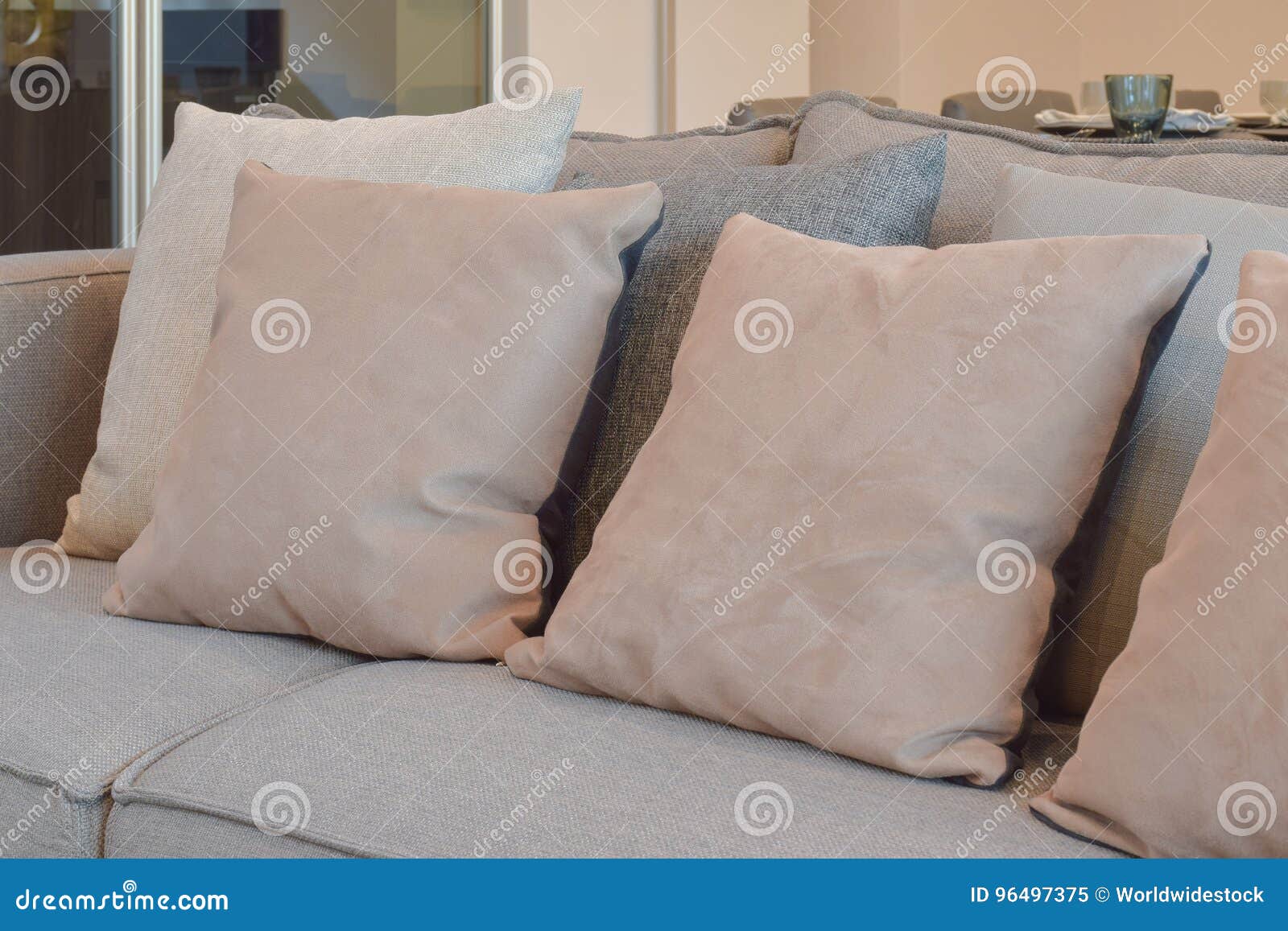 Light Brown, Beige and Gray Pillows Setting on Sofa in Living Room