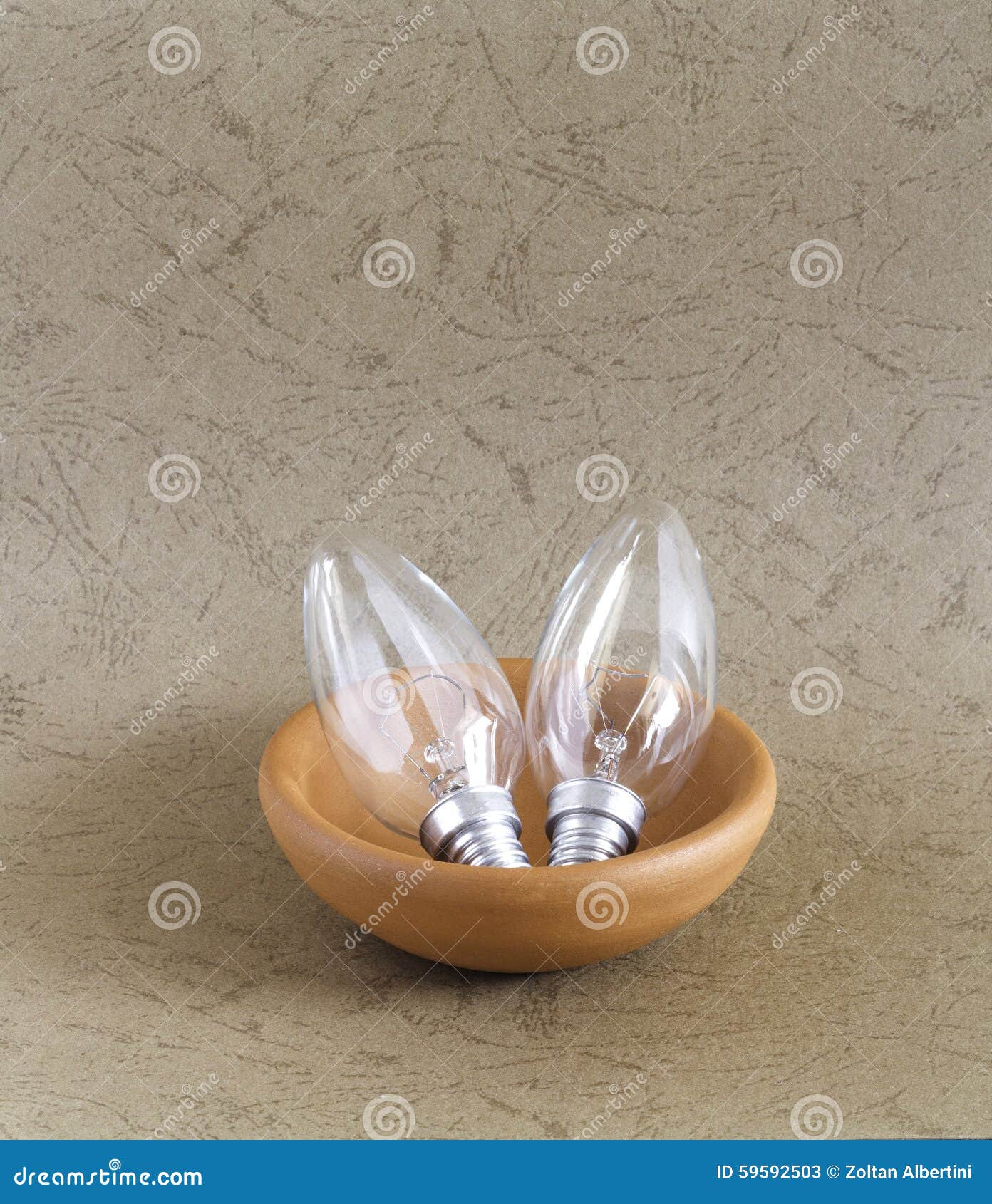 Light bulb in ceramic bowl stock image. Image of heat 59592503