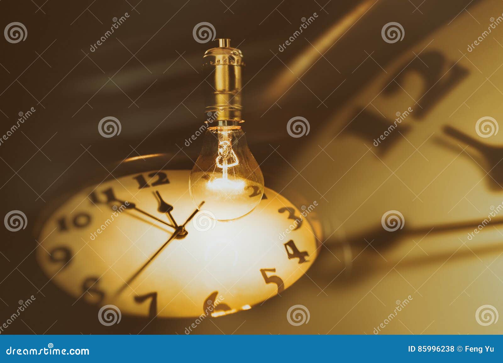 Light bulb and clock stock photo. Image of inspiration - 85996238