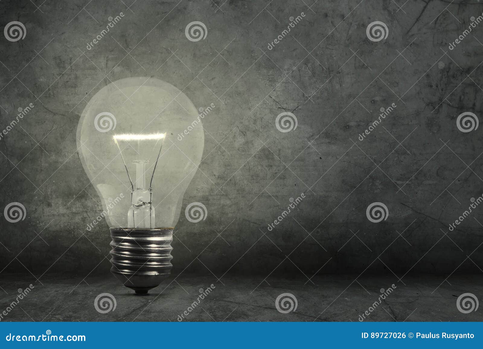 Light bulb and grey wall stock photo. Image of solution 89727026