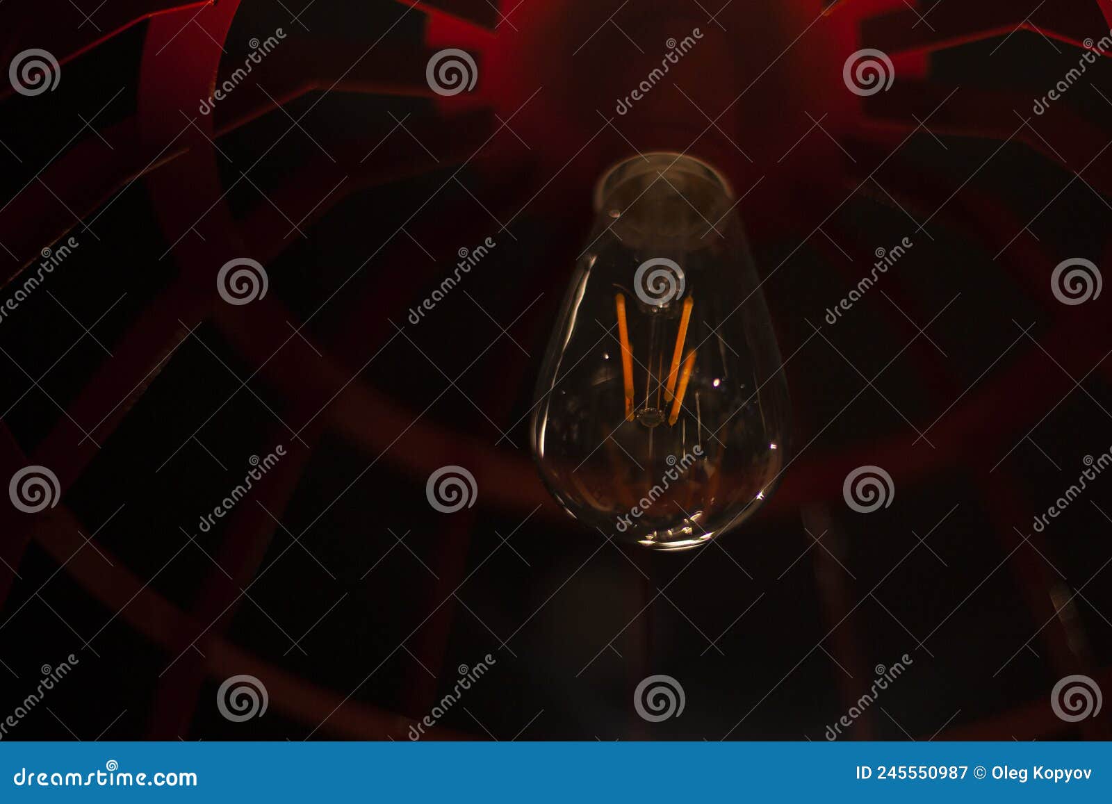 Light Bulb in the Interior. Light Bulb in a Dark Room Stock Image