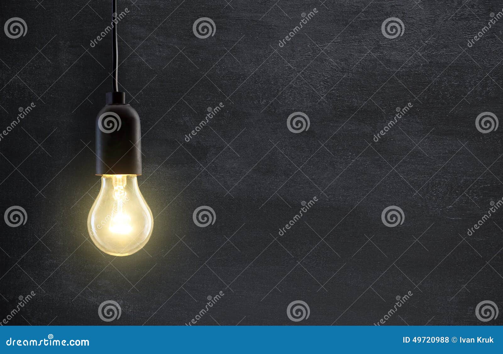 light bulb lamp on blackboard