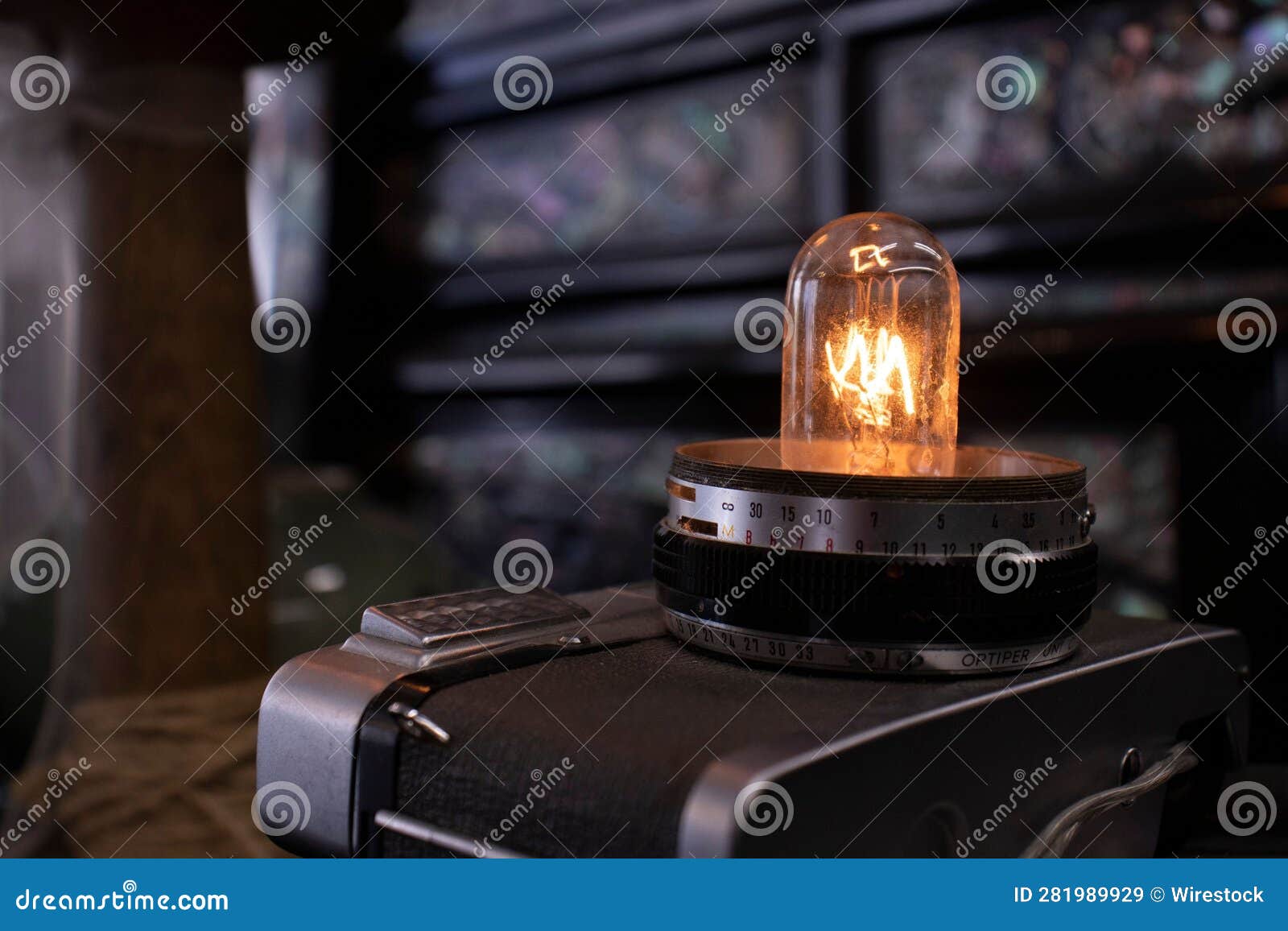 Light Bulb on an Old Camera Lens. Stock Image Image of technical