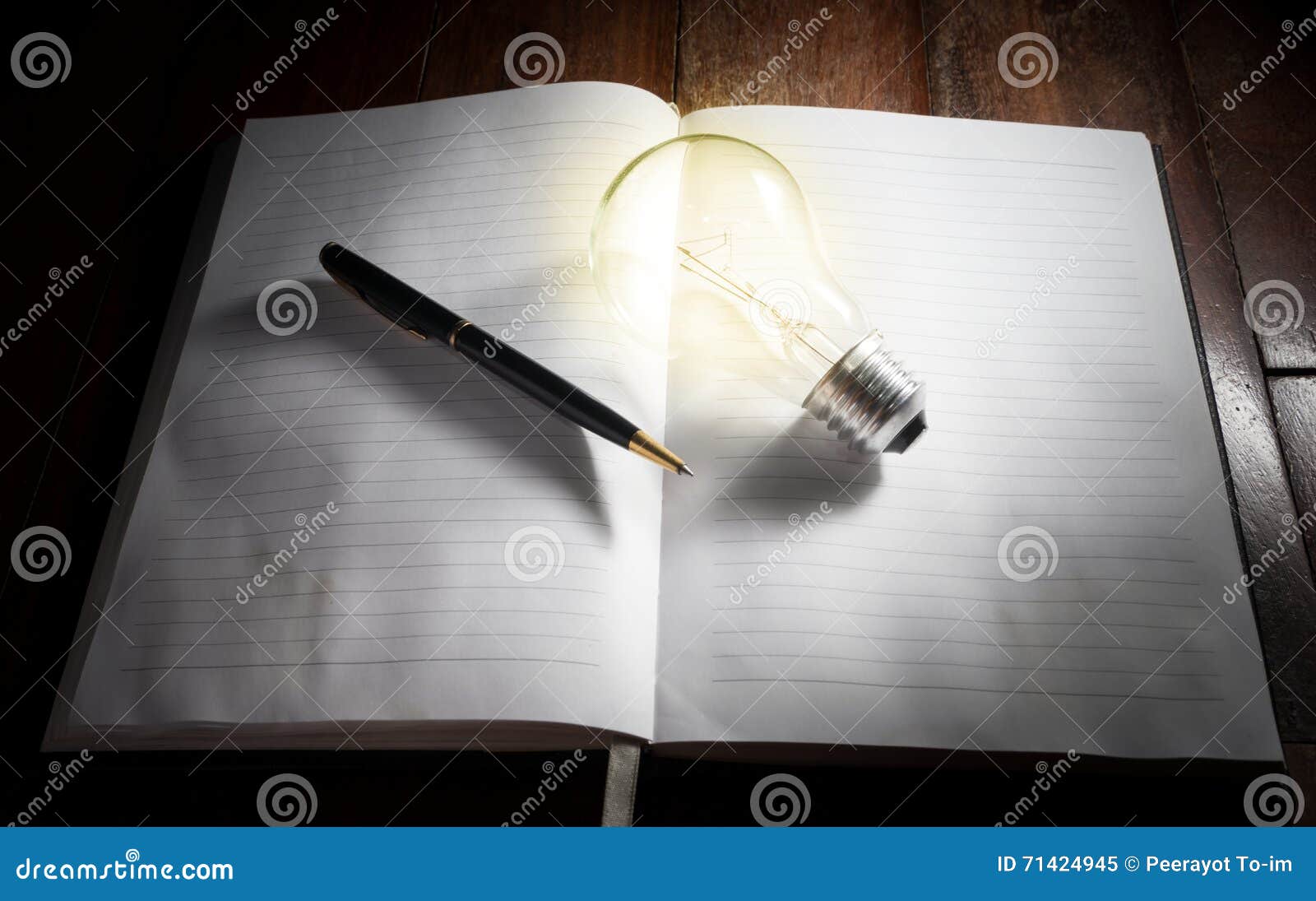 Light Bulb with Pen on Book. Stock Image Image of glowing, education