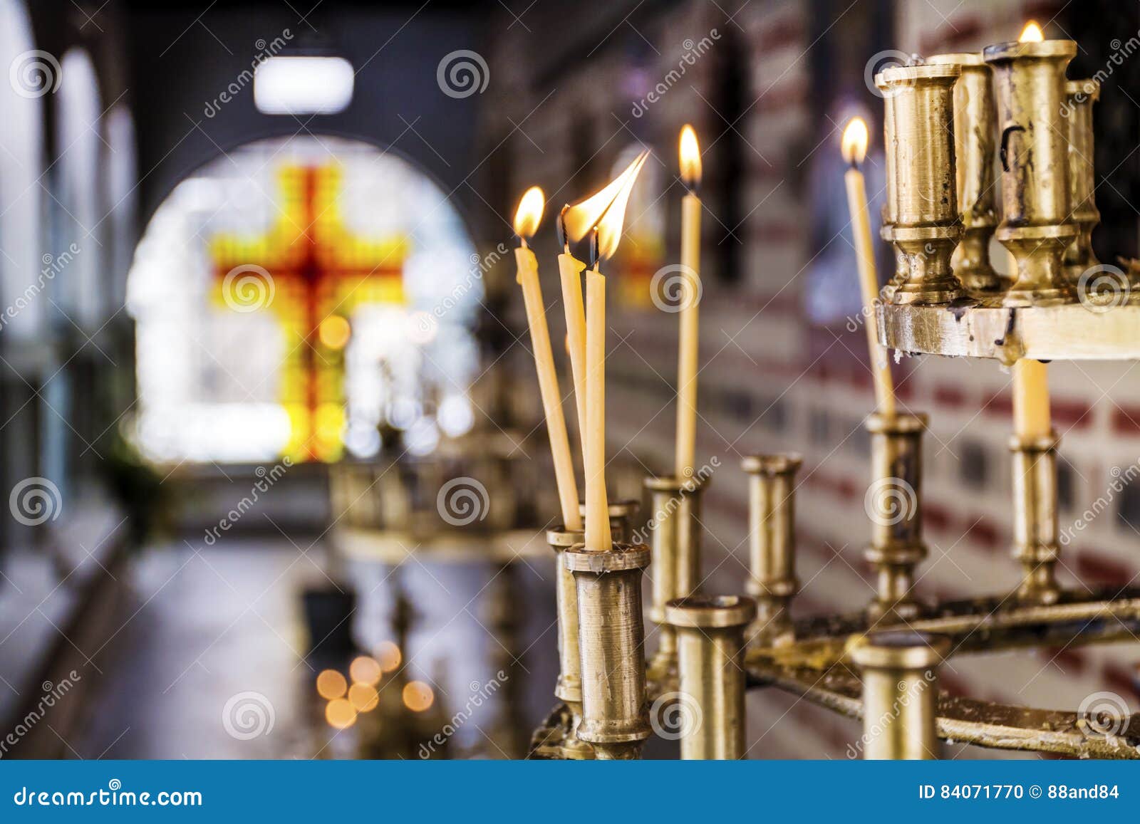 Light candles in a church stock photo. Image of adult 84071770