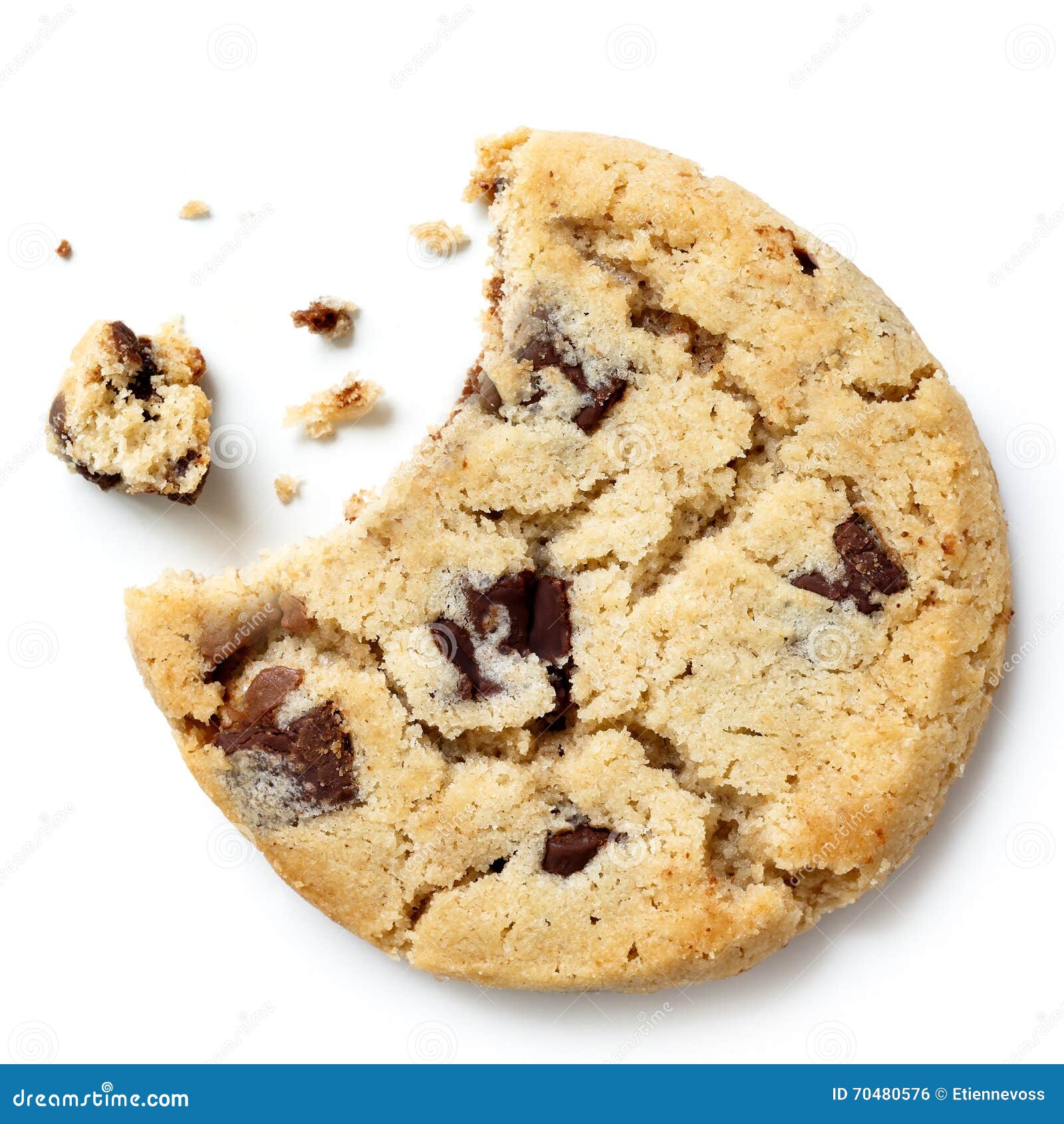 light chocolate chip cookie, bite missing with crumbs from above