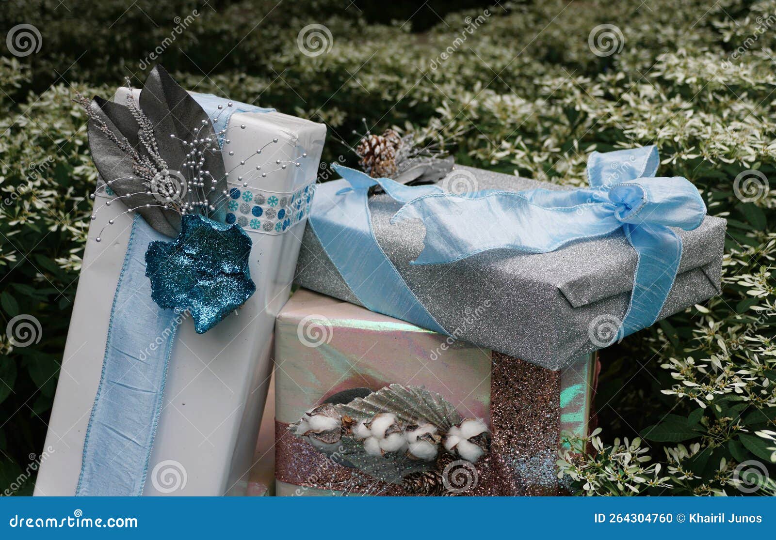 Light Color Boxes of Wrapped Presents Underneath a Christmas Tree Stock
