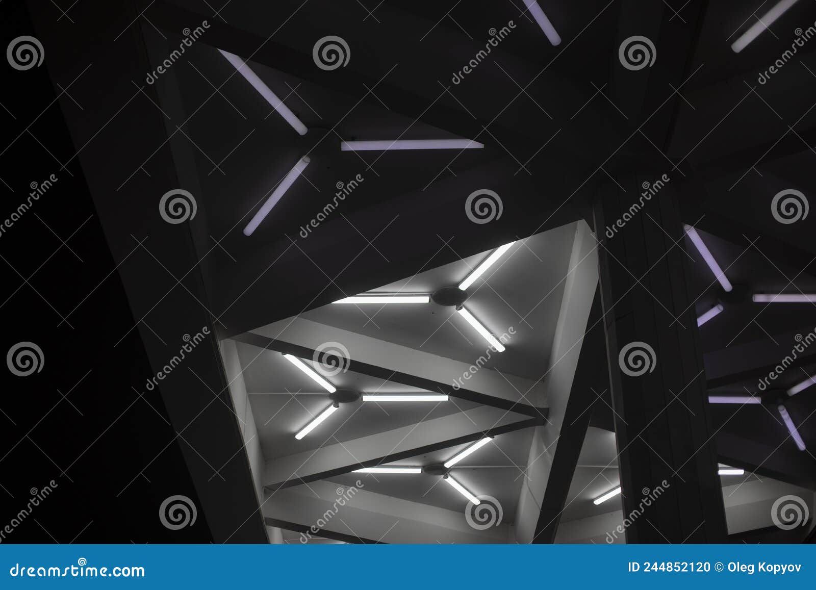 Light Design. Fluorescent Lamps on Ceiling. Triangles of Lamps Stock