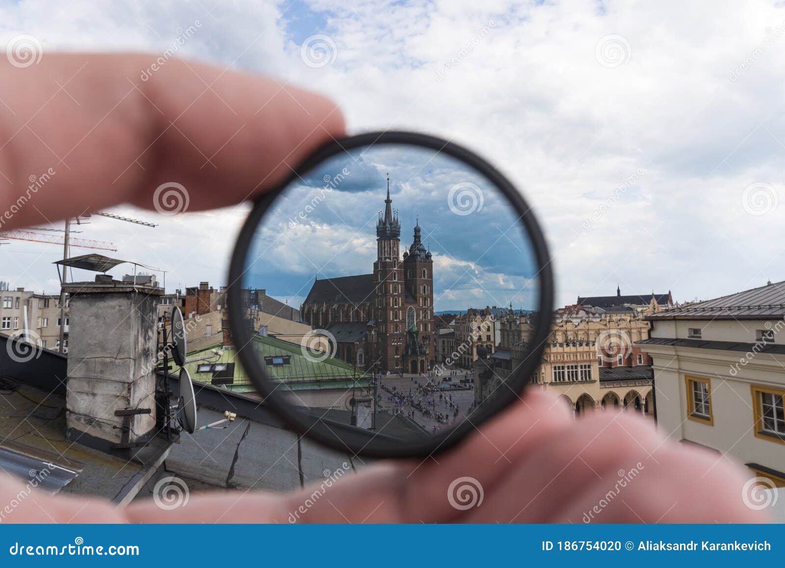 light or optical filter with view of church bazylika mariacka or towers of st.mary`s. top view from roof or balcony to old krakow