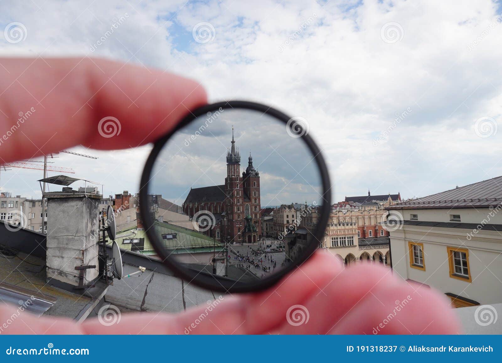 light or optical filter with view of church bazylika mariacka or towers of st.mary`s. top view from roof or balcony to old krakow