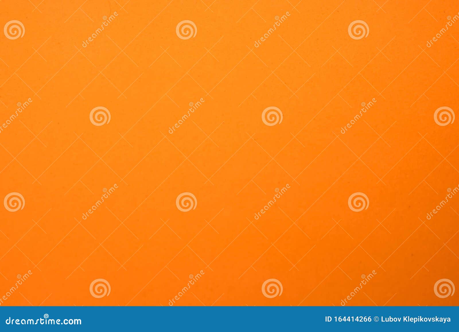 light orange matte background of suede fabric, closeup. velvet texture of seamless ginger woolen felt