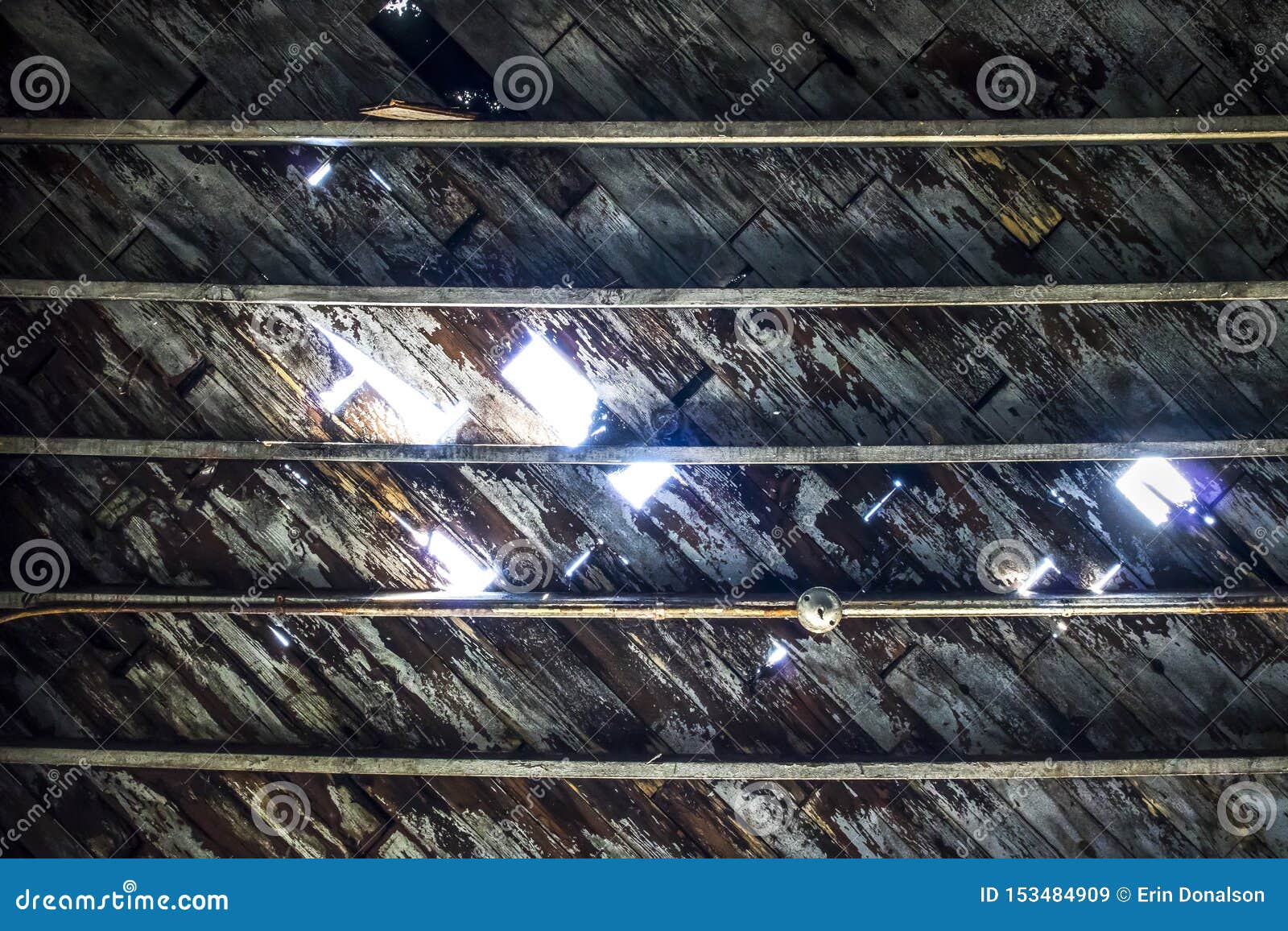 Light Through Peeling And Deteriorating Wooden Ceiling Stock Image