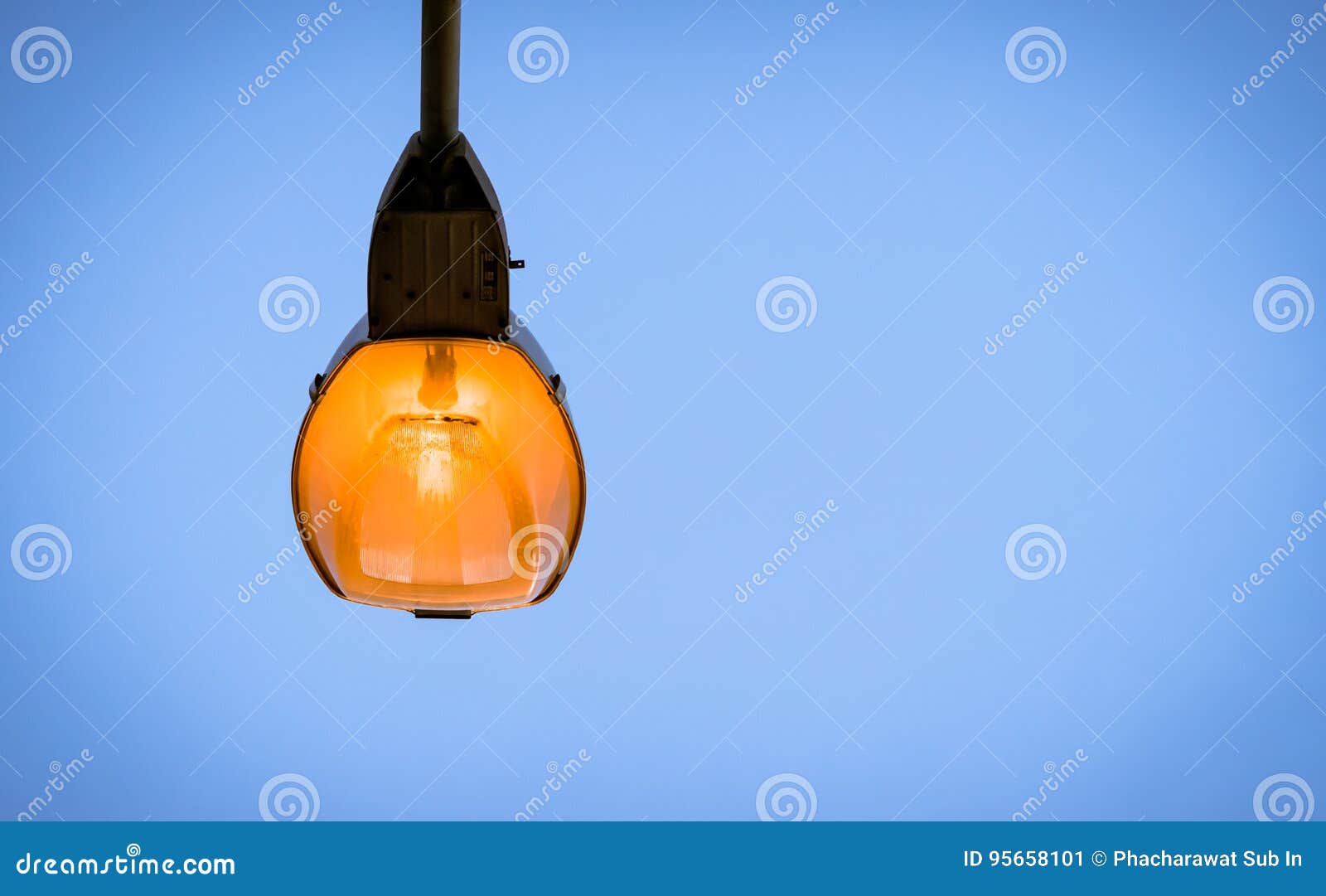 a light pole on blue sky background in twilaght period