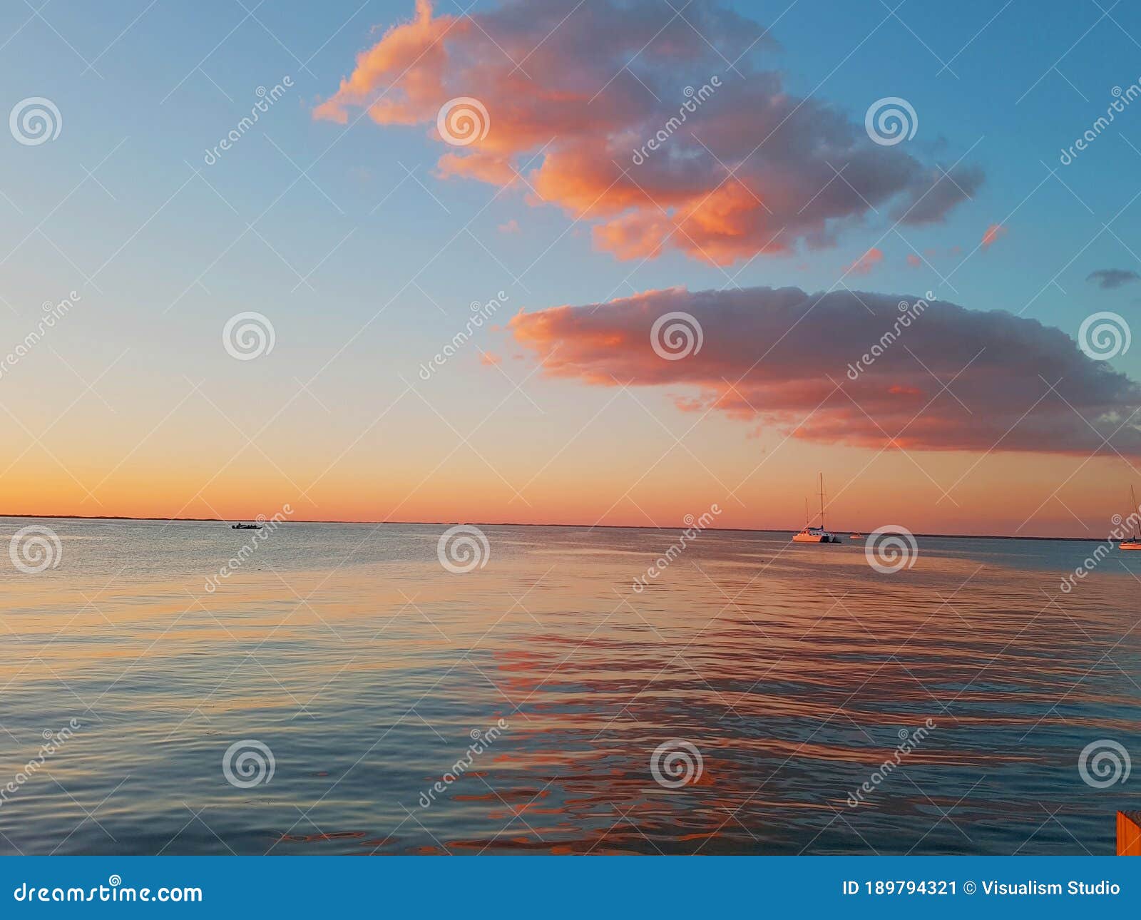 Light Red Sunset Beautiful View Panorama Blue Sea With Gray Cloud Sky