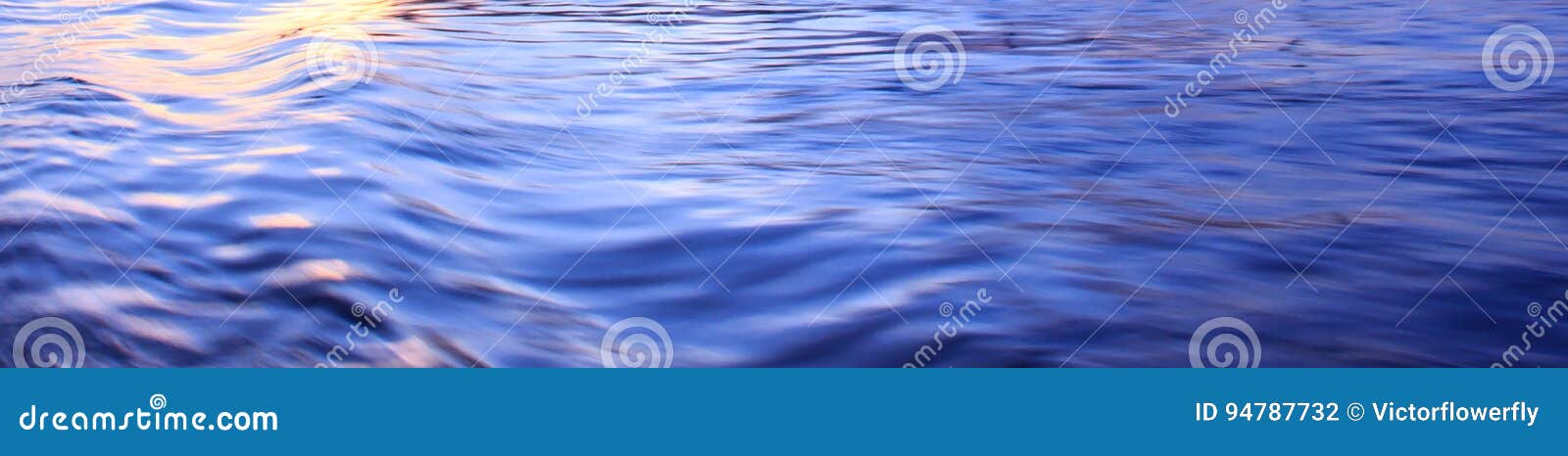 light reflection on blue river wave ripples surface. abstract, tranquility, romance