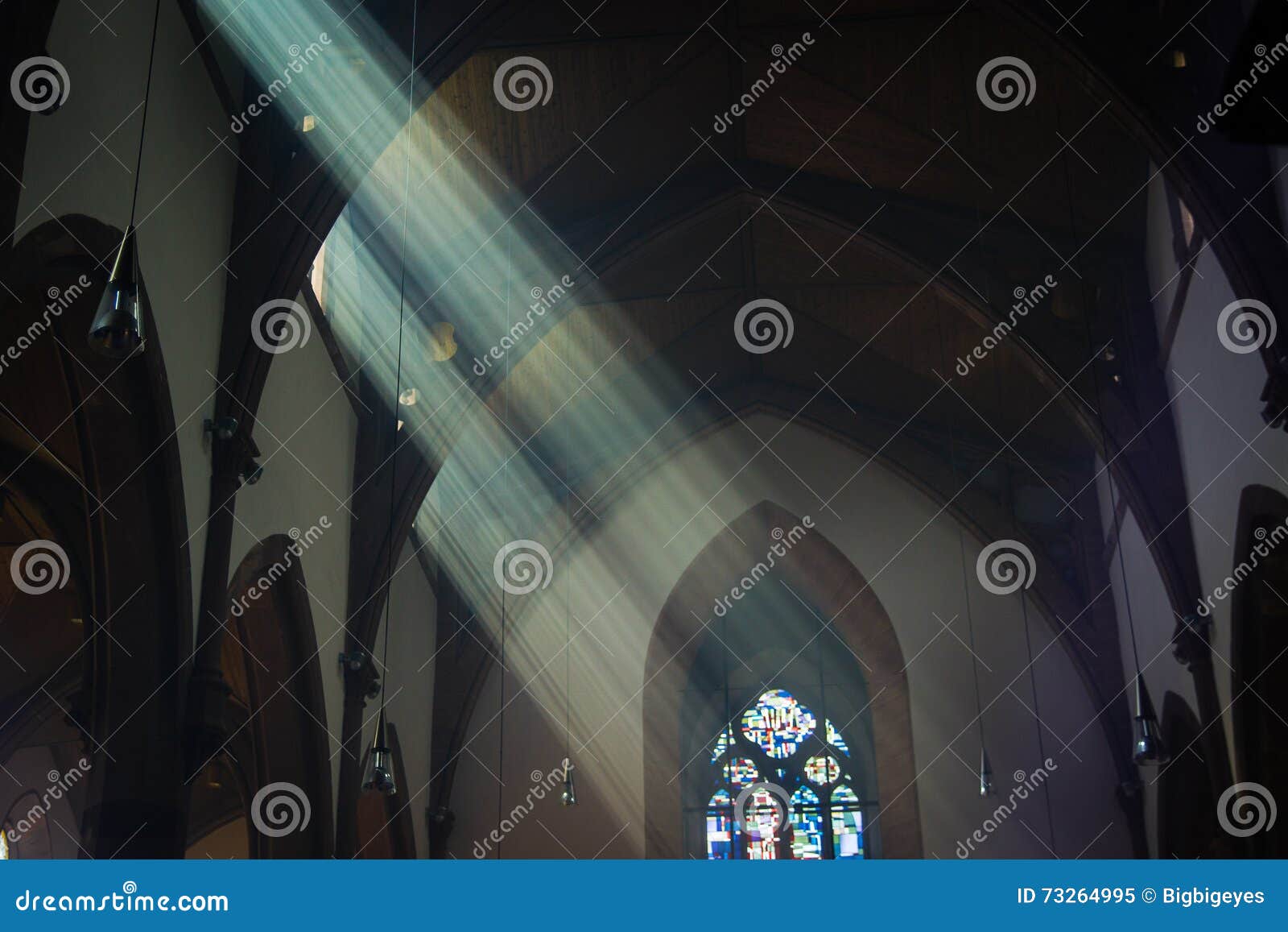light shafts stream into church window