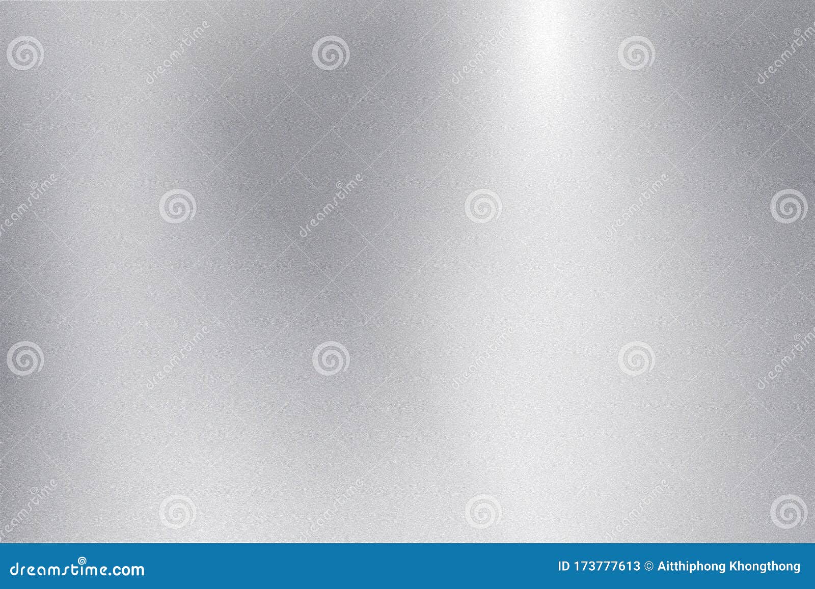 light shining down on silver foil metallic wall with copy space, abstract texture background
