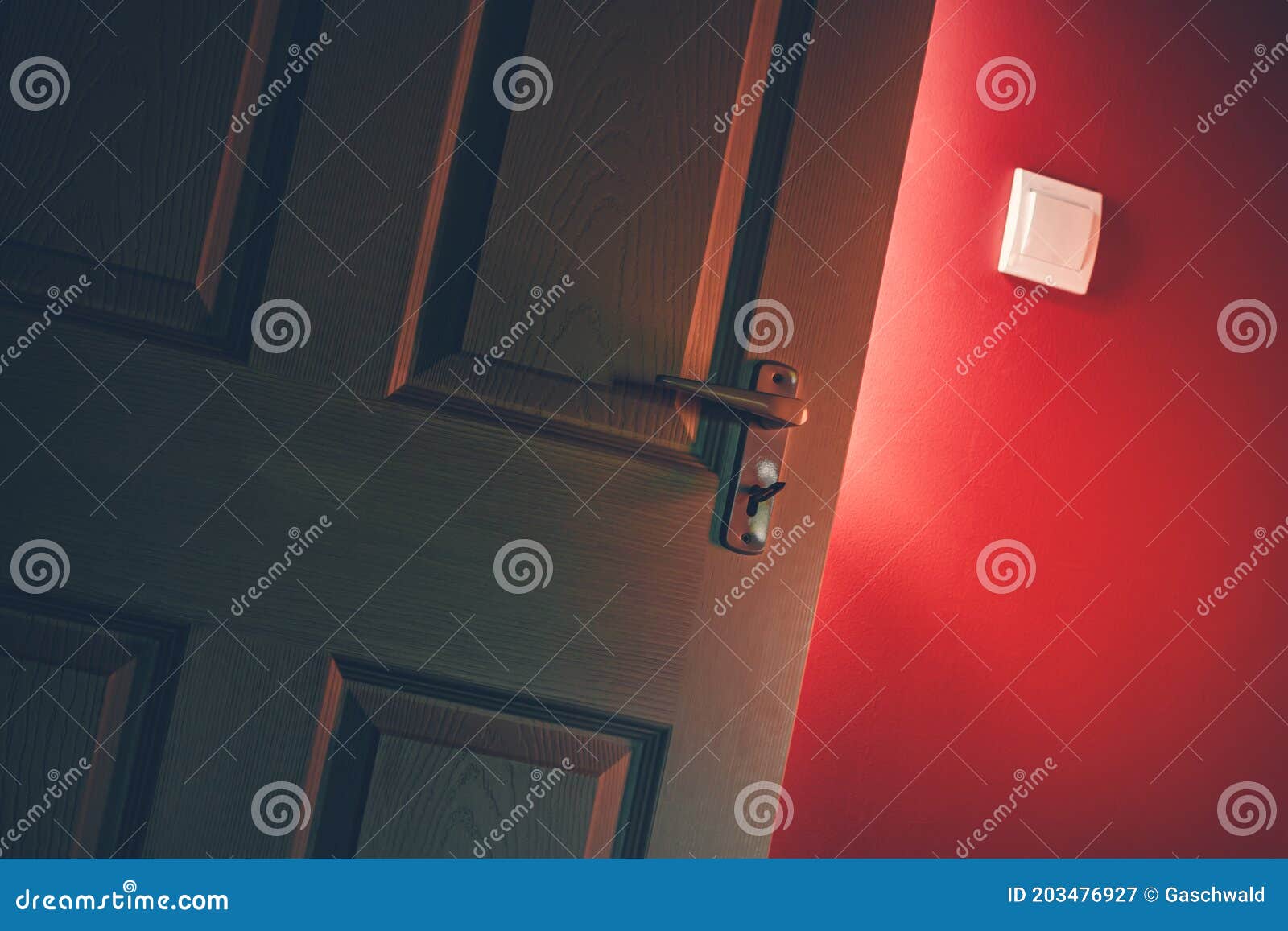 Light Shining Through Open Door In Dark Room With Red Wall Mystery Success Hope Concept Stock