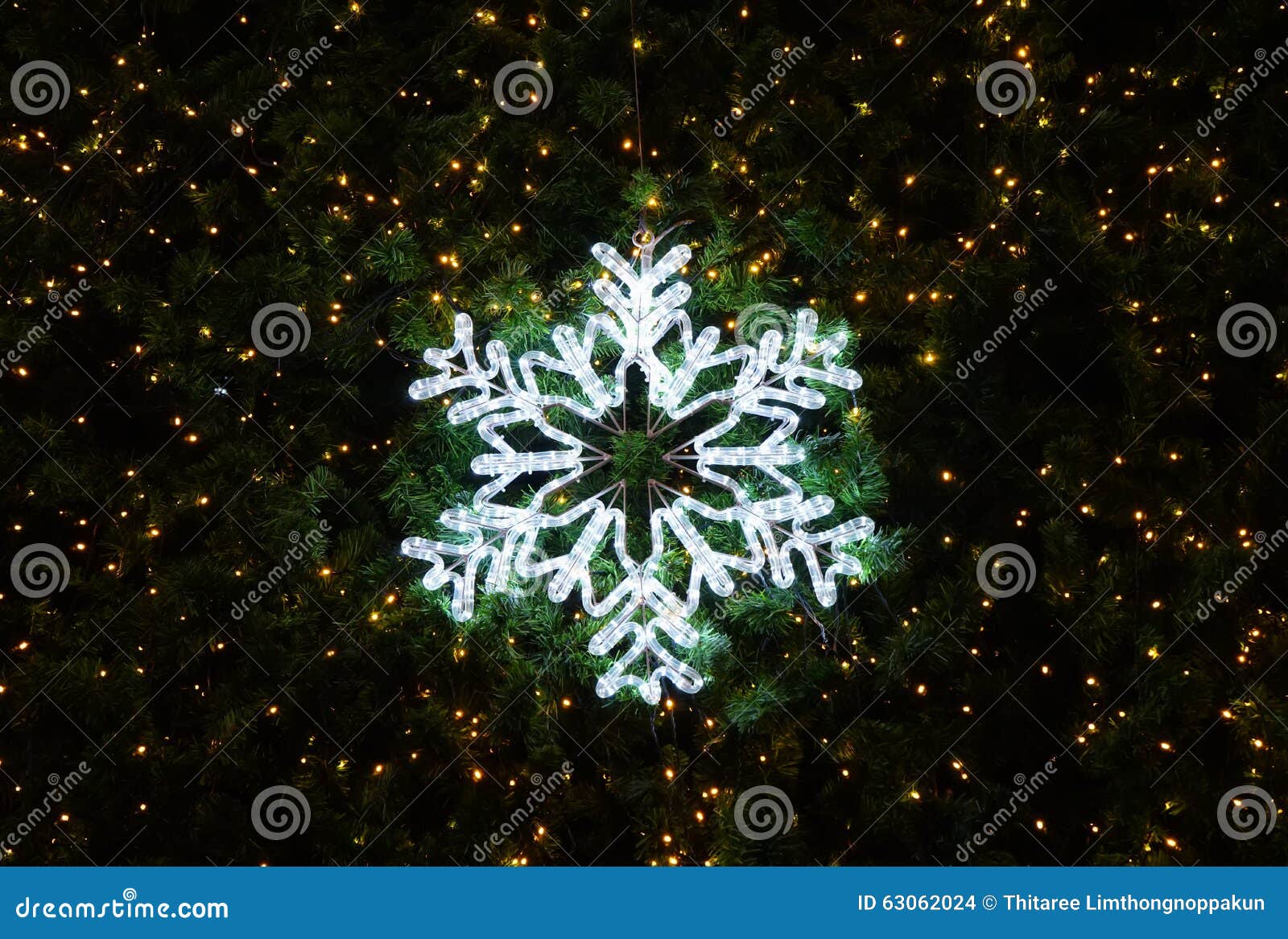 Light of Snowflake Decorated on Christmas Tree, Dark Background Stock