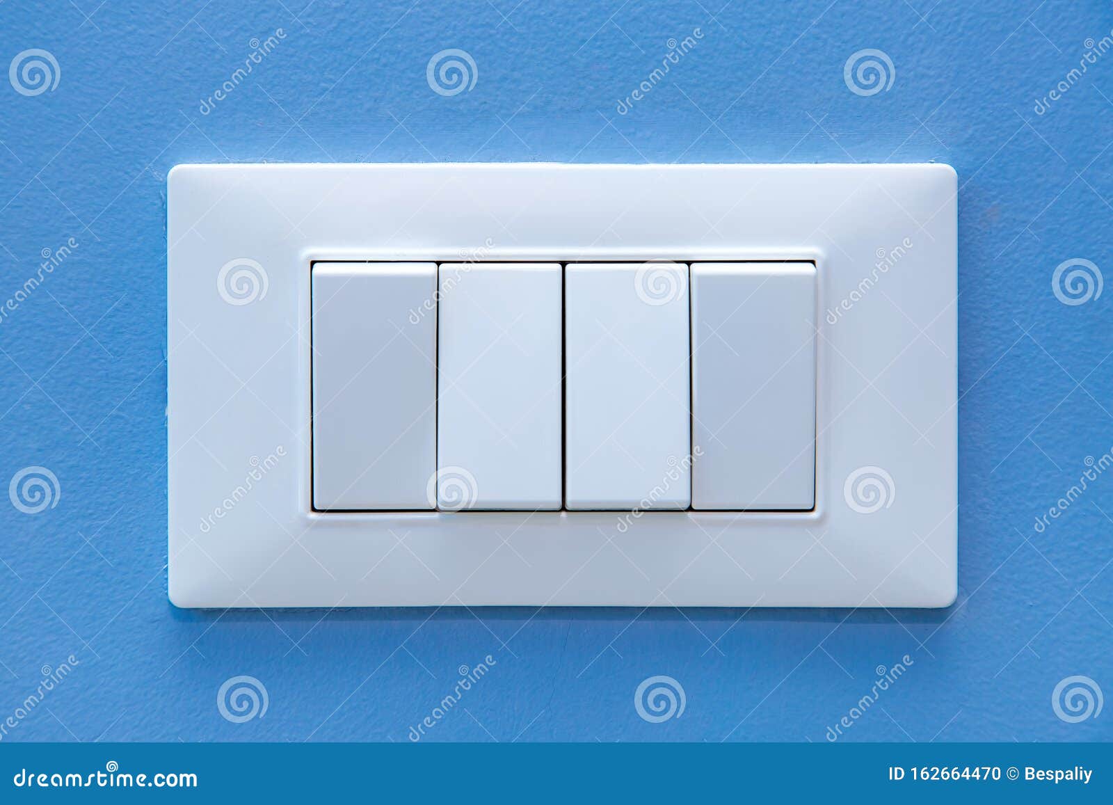 A Light Switch, a Plastic Mechanical Multiple Buttons. Stock Photo