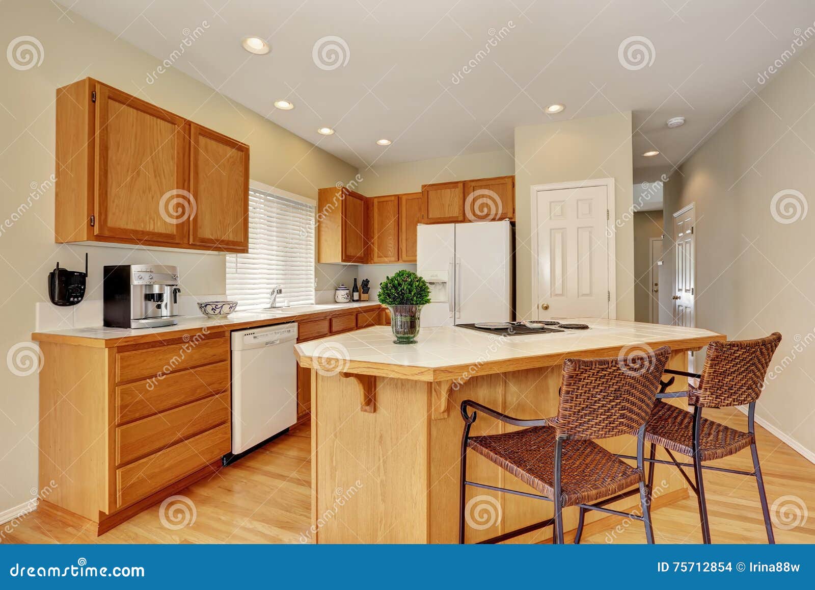 Light Wooden Kitchen Interior with Kitchen Island and Wicker Stools