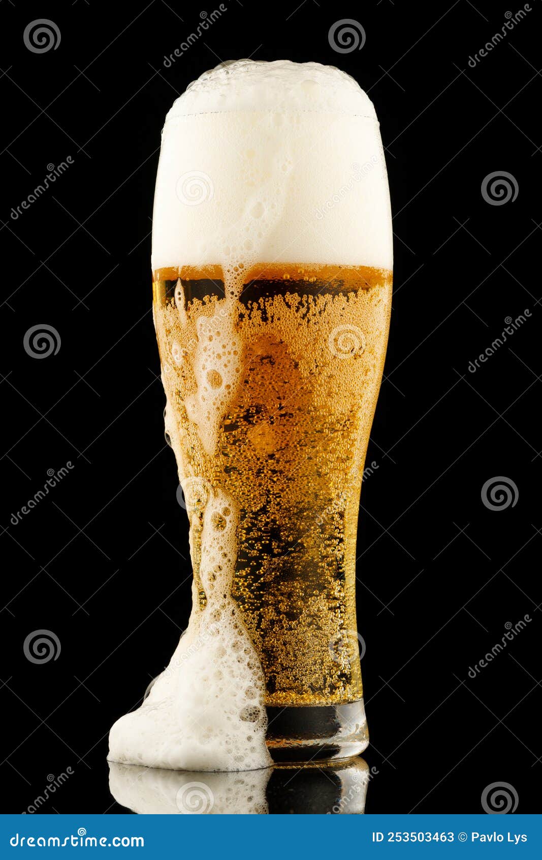 Light Yellow Beer with Foam in a Glass Black Background Stock Image