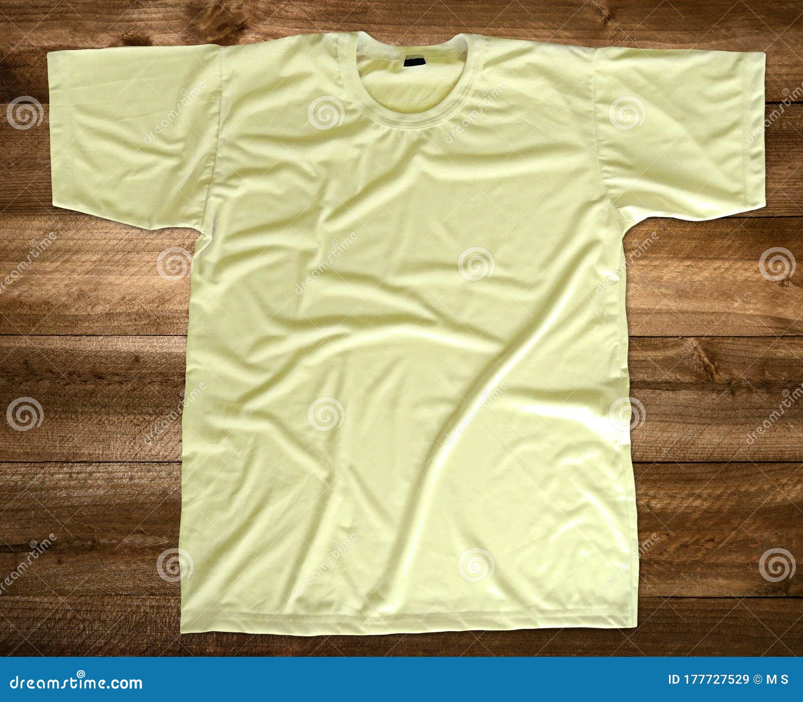 Download Light Yellow T-shirt Mockup Front View Wooden Background ...