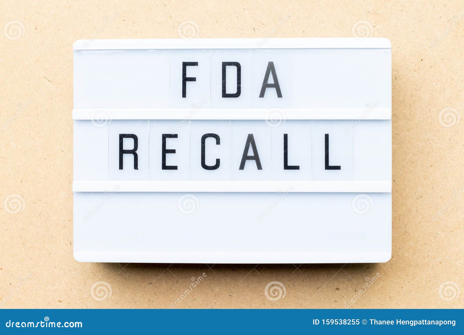 lightbox with word fda recall on wood background