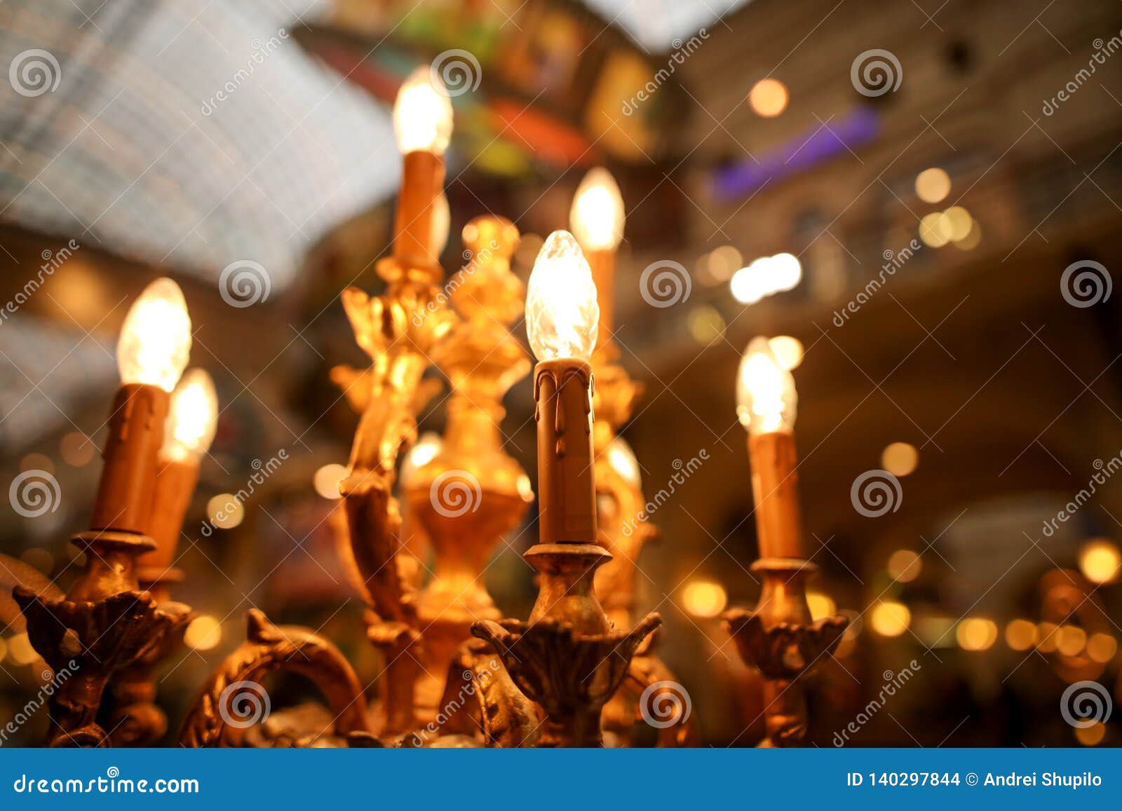 Lightbulbs on an Antique Candlestick Stock Photo Image of background
