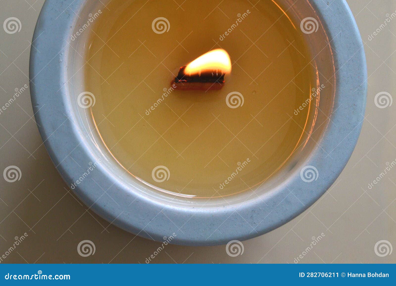 A Lighted Candle in a Blue Glass Stock Image Image of circle, produce