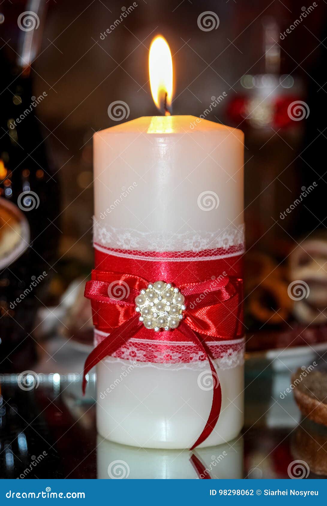 Lighted candle at wedding stock photo. Image of brooch 98298062